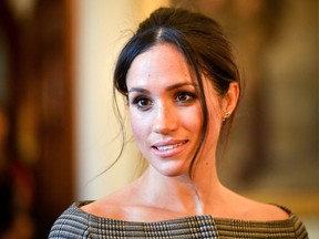 Meghan Markle chats with people inside the Drawing Room during a visit to Cardiff Castle on January 18, 2018 in Cardiff, Wales.