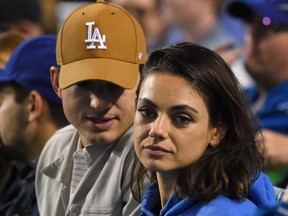 Actors Ashton Kutcher and Mila Kunis attend the game between the Los Angeles Dodgers and the Oakland Athletics at Dodger Stadium on April 11, 2018 in Los Angeles, Calif.