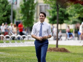 Prime Minister Justin Trudeau arrives to a news conference after visiting a COVID-19 vaccination clinic in Ottawa July 2, 2021.