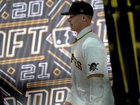Louisville's Henry Davis walks across the stage after being selected by the Pittsburgh Pirates as the number one overall pick of the 2021 MLB draft, Sunday, July 11, 2021, in Denver.