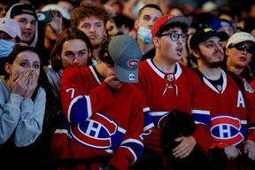 Fans react as they watch the end of game five of the NHL Stanley Cup Finals between the Montreal Canadiens and Tampa Bay Lightning ice hockey teams in Montreal, Quebec, Canada, July 7, 2021. REUTERS/Andrej Ivanov