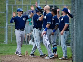 The Toronto Maple Leafs celebrate two of their 18 runs batted in against the Welland Jackfish during a drizzly home opener at Dominico Field at Christie Pits in Toronto, Ont. on Sunday, July 11 2021.