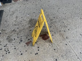 Blood at the scene of a fatal shooting at Westown Plaza, on Islington Ave. east of Dixon Rd., on Tuesday, July 20, 2021.