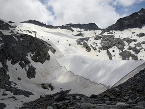 Large white geotextile sheets cover northern Italy's Presena glacier in order to delay snow melting on skiing slopes and reflect sunlight during summer months, at Passo del Tonale, near Trento, Italy, July 13, 2020.