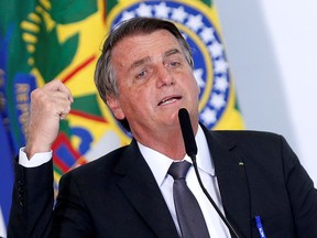 Brazil's President Jair Bolsonaro speaks during a ceremony to sign a law for the privatization of state-controlled electricity utility Eletrobras, at the Planalto Palace in Brasilia, Brazil, July 13, 2021.