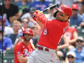 Reds batter Joey Votto hits a two-run home run in the first inning against the Cubs at Wrigley Field in Chicago, Thursday, July 29, 2021.