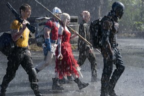 Joel Kinnaman as Rick Flag, John Cena as Peacemaker, Margot Robbie as Harley Quinn, Peter Capaldi as The Thinker and Idris Elba as Bloodsport in Suicide Squad.