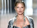 British model Kate Moss presents a creation by British designer Kim Jones for Fendi's spring-summer 2021 collection during Paris Fashion Week on January 27, 2021.