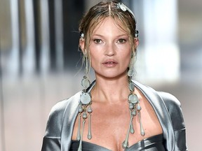 British model Kate Moss presents a creation of British designer Kim Jones for the Fendi's Spring-Summer 2021 collection during the Paris Haute Couture Fashion Week, in Paris, on Jan. 27, 2021.