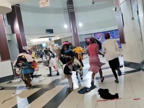 Demonstrators loot the The Ridge At Shallcross Shopping Centre as protests continue, following imprisonment of former South Africa President Jacob Zuma, in Durban, KwaZulu-Natal, South Africa July 11, 2021.