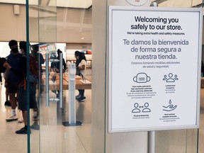 People visit an Apple store in the Oculus Mall in Manhattan, N.Y., Friday, July 29, 2021. Numerous stores in the mall have required guests to start wearing masks again as the Delta variant of COVID-19 spreads through New York City.