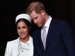 In this file photo taken on March 11, 2019 Prince Harry and Meghan leave after attending a Commonwealth Day Service at Westminster Abbey in central London.