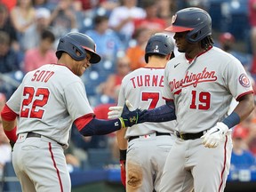 Washington Nationals first baseman Josh Bell (19) celebrates with left fielder Juan Soto (22) after hitting a home run against the Philadelphia Phillies at Citizens Bank Park.