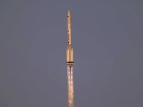 This handout photograph taken and released by the Russian Space Agency Roscosmos on July 21, 2021, shows a Russian Proton-M rocket carrying the Dutch European Robotic Arm and the Russian Multipurpose Laboratory Module "Nauka" (Science) blasting off from the launch pad at the Russian-leased Baikonur cosmodrome in Kazakhstan on July 21, 2021.