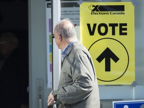 A man arrives to cast his ballot at a polling station on federal election day in Shawinigan, Que., Monday, Oct. 21, 2019.