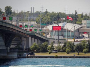 Trucks cross The Peace Bridge, which runs between Canada and the United States, over the Niagara River in Buffalo, N.Y., July 15, 2020.
