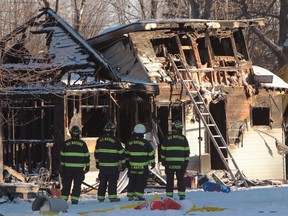 Firefighters and Ontario Fire Marshall officials attend the scene of a house fire on Oneida Nation of the Thames, southwest of London, Ont., Dec. 15, 2016.  OPP say say the remains of five people were identified as 43-year old Kurt Justin Antone, and four children, Keanu Antone, 7, Kenneth Antone, 4, Kance Antone, 3, and three-month old Kyias Antone.