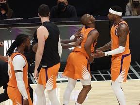 Patrick Beverley of the LA Clippers pushes Chris Paul of the Phoenix Suns during the second half in Game 6 of the Western Conference Finals at Staples Center on June 30, 2021 in Los Angeles, Calif.