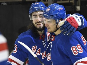 New York Rangers center Mika Zibanejad, left,  and right wing Pavel Buchnevich celebrate after scoring during the second period against the Toronto Maple Leafs at Madison Square Garden in New York, Feb. 5, 2020.