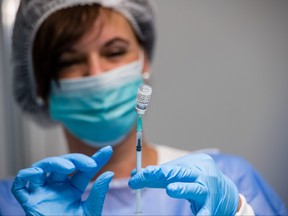 Medical staff prepares syringes that contain the Pfizer/BioNTech vaccine against COVID-19 at a mass vaccination center on July 1, 2021 in Leipzig, Germany.
