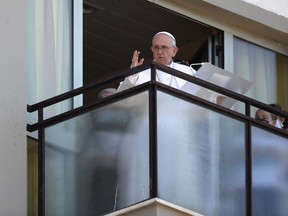 Pope Francis leads the Angelus prayer from a balcony of the Gemelli hospital, as he recovers following scheduled surgery on his colon, in Rome, Italy, July 11, 2021.
