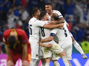 Italy's players celebrate after defeating Belgium 2-1 in a Euro 2020 quarter-final at the Football Arena in Munich, Germany. Reuters