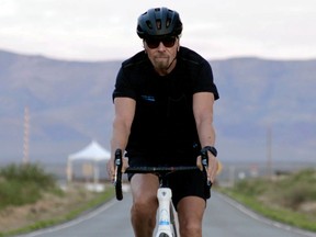 Richard Branson arrives by bicycle to Spaceport America near Truth or Consequences, New Mexico, July 5, 2021, in a still image from a video.