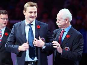 Lanny McDonald gives the Hall of Fame jacket to Sergei Fedorov ahead of the Legends Classic at the Air Canada Centre in Toronto on Sunday November 8, 2015.