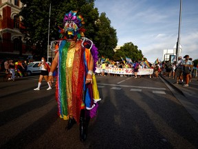 A reveller wearing a costume takes part in the Gay Pride parade in Madrid, Spain, July 3, 2021.