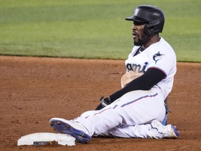 Starling Marte of the Miami Marlins rests after stealing second base against the San Diego Padres at loanDepot park on July 25, 2021 in Miami, Florida.