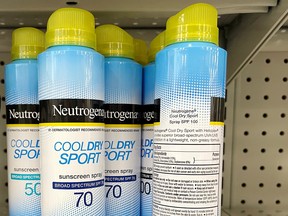 Johnson &Johnson’s Neutrogena Cool Dry Sport sunscreen, which is part of a voluntary recall of five Neutrogena and Aveeno brand aerosol sunscreen products after a cancer-causing chemical was detected in some samples, sits on a shelf at a store in Gloucester, Massachusetts, July 15, 2021.