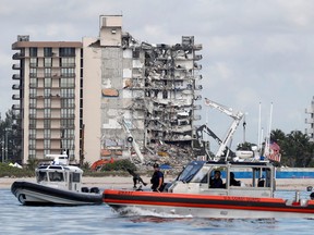 U.S. Coast Guard and Miami-Dade Police patrol as U.S. President Joe Biden visits the area while rescue efforts are halted at the site of a partially collapsed residential building in Surfside, near Miami Beach, Fla., July 1, 2021.
