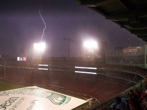 Lightning strikes outside Fenway Park during a rain delay on July 27, 2021. The scheduled game between the Toronto Blue Jays and the Boston Red Sox was rained out.