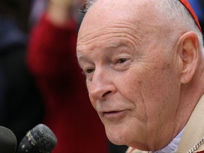 In this file photo taken on April 3, 2005, Cardinal Theodore McCarrick, Archbishop of Washington, speaks to reporters outside the Cathedral of Saint Matthew the Apostle in Washington, D.C.