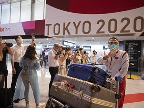 China's Table Tennis Association president Liu Guoliang arrives for the Tokyo 2020 Olympic Games at Narita International Airport in Narita, Chiba prefecture on July 17, 2021.