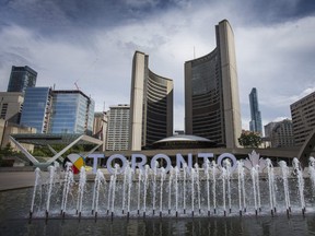 Toronto City Hall at Nathan Phillips Square. Closures come one day after the province announced renewed lockdowns and restrictions on city businesses, including a return of indoor dining bans.