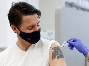 Prime Minister Justin Trudeau receives his second coronavirus vaccine at a pharmacy in Ottawa, July 2, 2021.