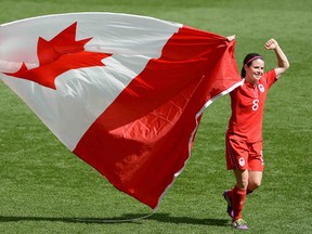 Diana Matheson of Canada celebrates their 1-0 win over Team France  to win the women's Bronze medal soccer match at the London 2012 Olympic Games.  Matheson scored the winning goal in injury time on Thursday August 9, 2012.