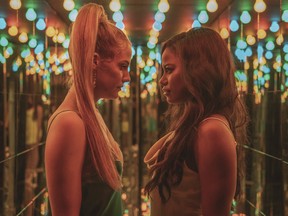 This image released by A24 shows Riley Keough, left, and Taylour Paige in a scene from "Zola."