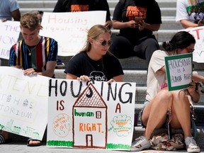 People camp out on the steps of the U.S. Capitol to highlight the upcoming expiration of the pandemic-related federal moratorium on residential evictions, in Washington, D.C., Saturday, July 31, 2021.