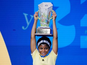 Zaila Avant-garde, 14, from New Orleans, Louisiana, holds up her trophy after winning the 2021 Scripps National Spelling Bee Finals at the ESPN Wide World of Sports Complex at Walt Disney World Resort in Lake Buena Vista, Florida July 8, 2021.