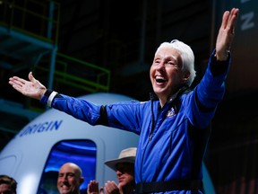 Wally Funk reacts after receiving her astronaut's wings from Blue Origin's Jeff Ashby, a former space shuttle commander at a post-launch press conference after she flew with three crewmates on Blue Origin's inaugural flight to the edge of space, in the nearby town of Van Horn, Texas, July 20, 2021.