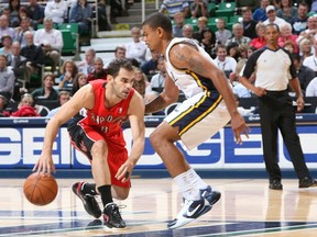 Earl Watson (right) defends Toronto's Jose Calderon during his playing days.