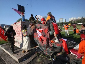 A group not protesters damaged statues of Queen Victoria and Queen Elizabeth in Winnipeg on July 1, 2021.
