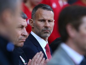 In this file photo taken on March 24, 2019 Wales' manager Ryan Giggs awaits kick off in the UEFA Euro 2020 Group E qualification football match between Wales and Slovakia at Cardiff City Stadium in Cardiff.