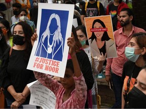 Women rights activists hold placards during a demonstration in Lahore on July 24, 2021, against the brutal killing of Noor Mukadam, the daughter of former Pakistan envoy to South Korea, in the federal capital earlier this week.