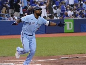 Toronto Blue Jays left fielder Teoscar Hernandez (37) reacts after hitting a solo homerun against the Kansas City Royals during the second inning at Rogers Centre.