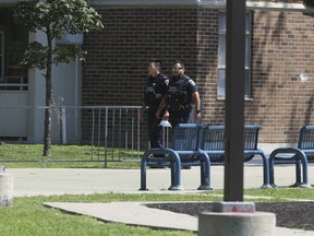 TCHC officers patrol a Falstaff Ave. highrise where a 12-year-old boy was shot on Friday night around 11 p.m. on Saturday, July 31, 2021.