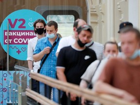 People line up to receive vaccine against the coronavirus disease (COVID-19) outside a vaccination centre in the State Department Store, GUM, in central Moscow, Russia June 25, 2021.