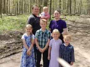 Jake and Tina Hiebert are pictured with their five children. The parents and three of the kids were badly hurt in a firepit mishap at a relative's home in Port Burwell. (Submitted)